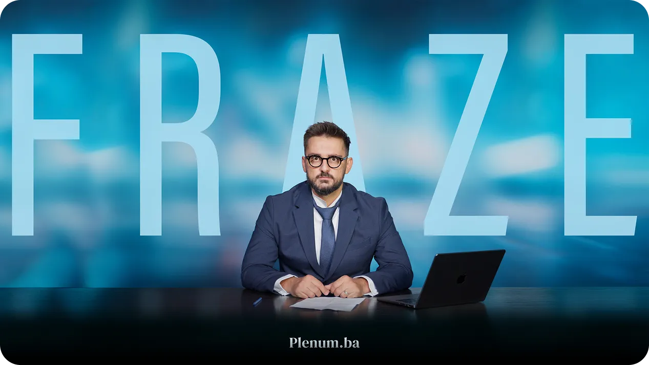 Man in a navy suit, glasses, and loosened tie sitting at a desk with a laptop and papers, with large semi-transparent letters spelling FRAZE in the background.