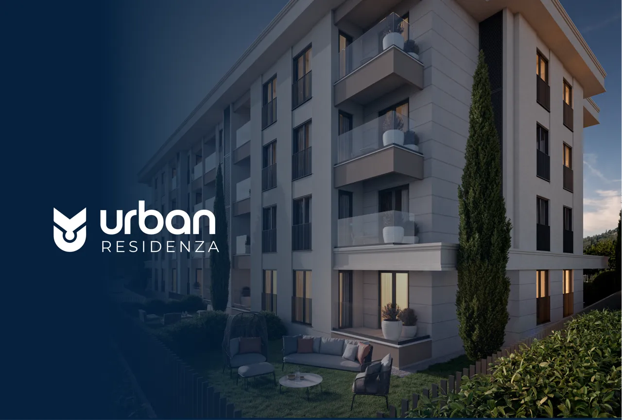 Modern residential building with balconies and outdoor seating area, featuring Urban Residenza logo on the left.
