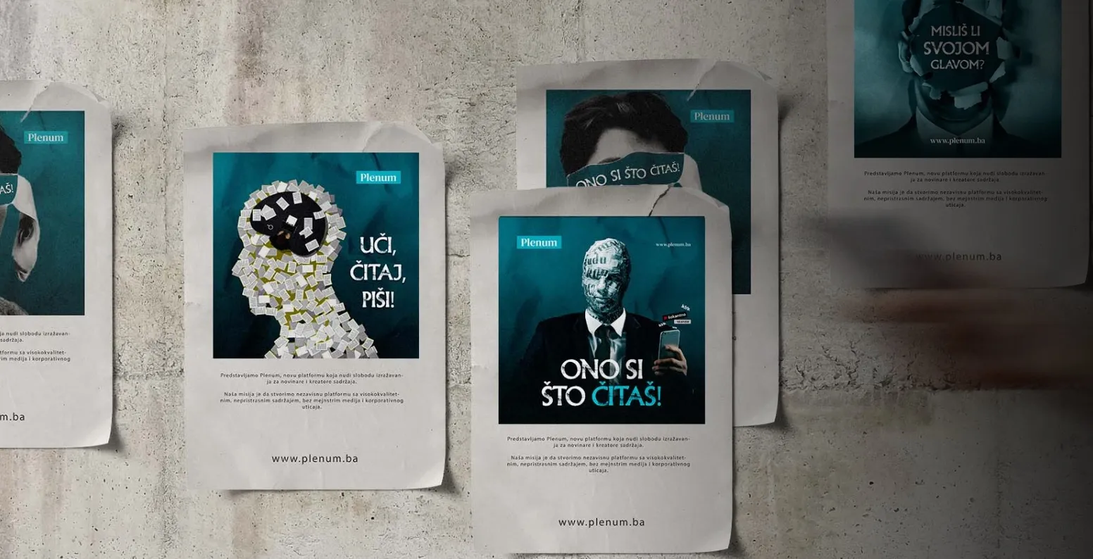 Posters on a wall promoting Plenum, featuring stylized human heads with text encouraging reading, writing, and critical thinking.