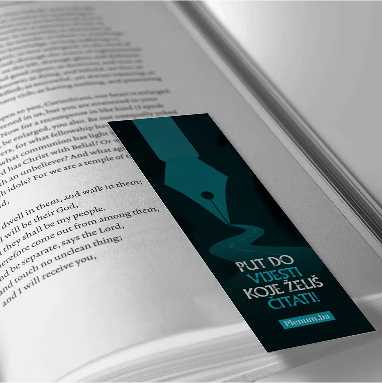 Open book with a dark blue bookmark featuring a fountain pen tip graphic and text in Bosnian saying 'Put do vijesti koje želiš čitati!!' and the URL Plenum.ba.