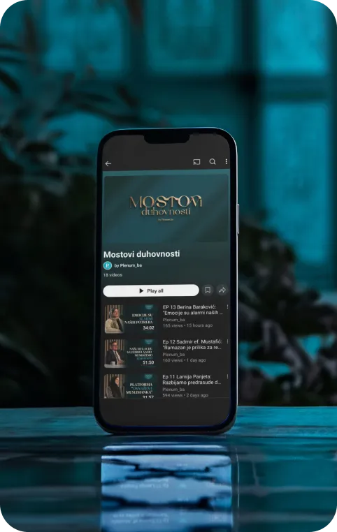 Smartphone displaying a podcast series titled 'Mostovi duhovnosti' with a dark blurred background.