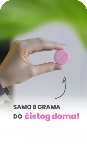 Hand holding a small pink tablet with text in Serbian saying 'Only 8 grams for a clean home!'